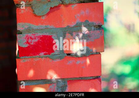 Red bricks and cement . Wall corner Stock Photo