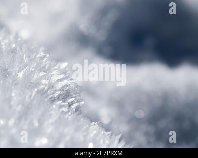 Abstract white and blue background of frozen snowflakes Stock Photo