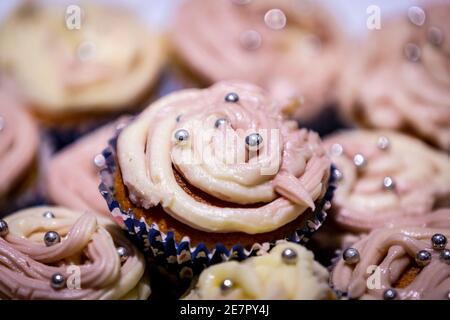 Homemade cupcakes piled on a plate, with a shallow depth of field Stock Photo