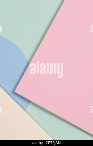 Abstract geometric texture background of fashion soft green, pastel pink, light blue, yellow color paper. Top view. Stock Photo