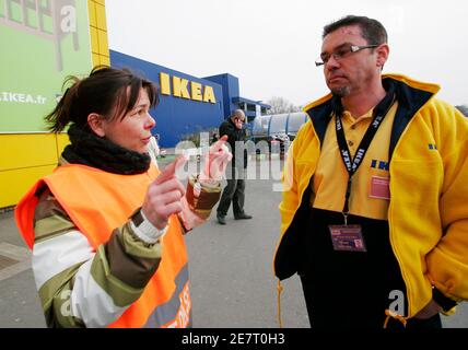 An union member (L), employee of Swedish retailer IKEA, argues with local  manager (R) during a demonstration demanding salary increases outside a Ikea  store in Bordeaux, southwestern France, February 13, 2010. REUTERS/Olivier
