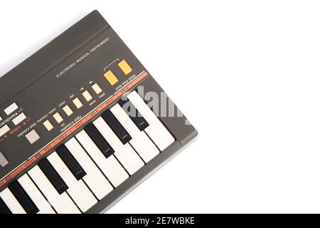Close up view of an electronic piano keyboard isolated on white background. Stock Photo