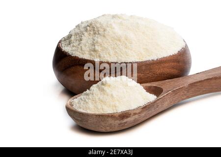 Full  fat powdered milk in wooden spoon isolated on white Stock Photo