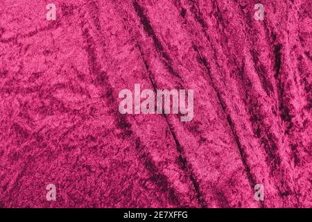 Dark pink panne velvet textile texture with folds Stock Photo