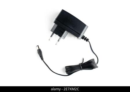 a ac dc black power adapter isolated on white background. view from above Stock Photo