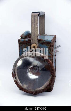 Old rusty blue railway lantern on white background. Stock Photo