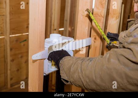 Installation in a new house of a laundry outlet boxes for connection of water in the washing machine Stock Photo