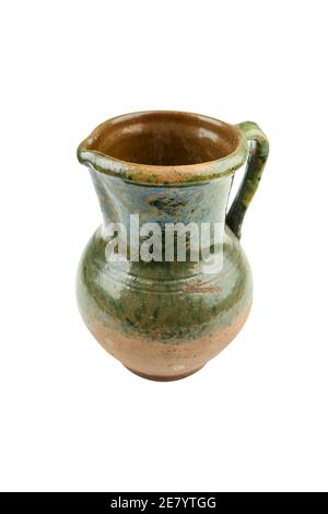 old archival green clay jug isolated on a white background Stock Photo