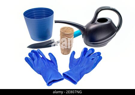 Horizontal shot of gardening implements isolated on white. Stock Photo