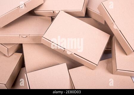 randomly Stacked brown paper boxes of the same size Stock Photo