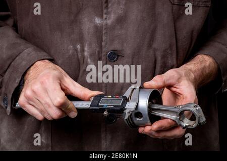 Measuring temperature of internal combustion Engine turbine by laser infrared  thermometer Stock Photo - Alamy