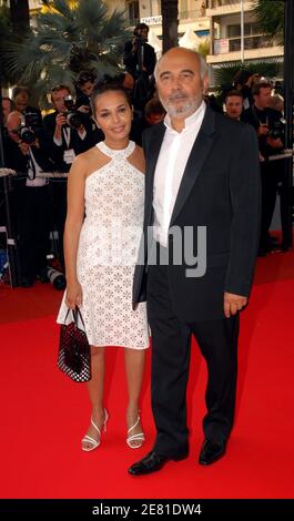 French actor Gerard Jugnot and his wife Saida Jawad walk the red carpet of the Palais des Festivals in Cannes, France, May 22, 2007, for the gala screening of US director Julian Schnabel's film Le Scaphandre et le Papillon (The Diving Bell and the Butterfly), presented in competition at the 60th Cannes International Film Festival. The movie is about Elle France editor Jean-Dominique Bauby, who, in 1995 at the age of 43, suffered a stroke that paralyzed his entire body, except his left eye. Photo by Hahn-Nebinger-Orban/ABACAPRESS.COM Stock Photo