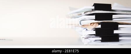 Extremely Close up Stack of Documents Folders on Office Desk Waiting to be Completed. Stock Photo