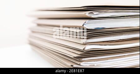 Extremely Close up Stack of Documents Folders on Office Desk Waiting to be Completed. Stock Photo