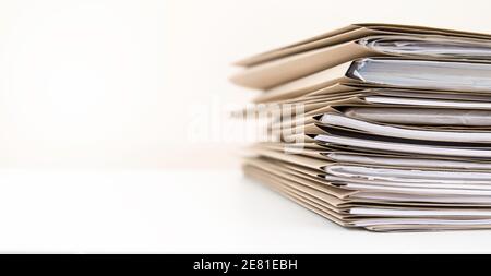 Extremely Close up Stack of Documents Folders on Office Desk Waiting to be Completed. Stock Photo