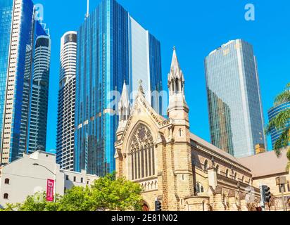 St Stephen's Cathedral dwarfed by glass skyscrapers, Brisbane, Queensland, Australia, Australasia Stock Photo