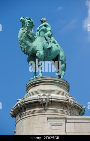 Sculpture of a boy riding camel at the entrance to Zoo Antwerpen, Antwerp Zoo, Belgium Stock Photo