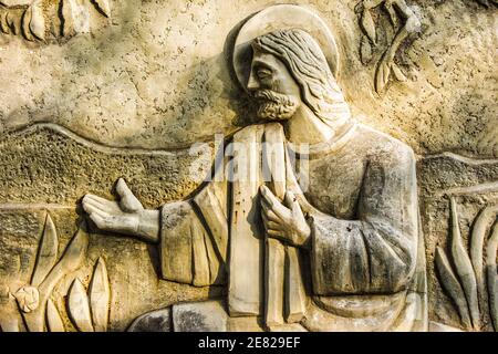 Closeup of Christ from a stone relief Biblical sculpture on the Sunday School Building of Plymouth Congregational Church in Coconut Grove in Miami, Fl Stock Photo