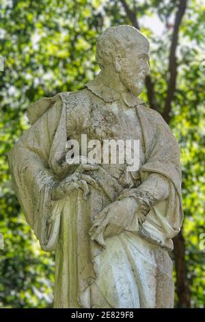 A Spanish style statue of a saint in the garden of Plymouth Congregational Church in Coconut Grove in Miami, Florida. Stock Photo