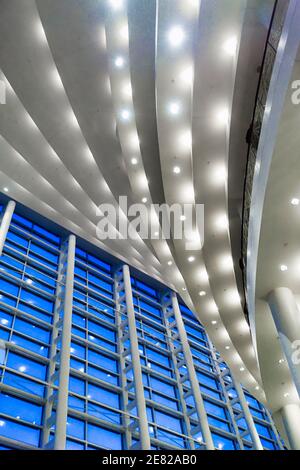 Blue hour through the multistory windows in the lobby of the Sanford and Dolores Ziff Ballet Opera Houseof The Arsht Center for the Performing Arts of Stock Photo