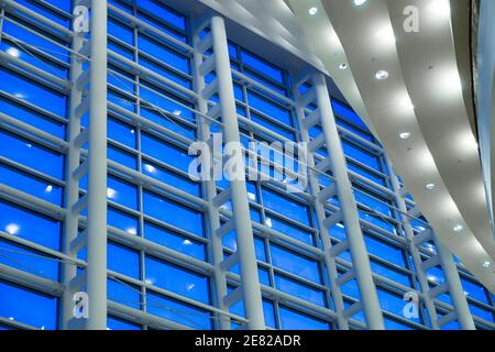 Blue hour through the multistory windows in the lobby of the Sanford and Dolores Ziff Ballet Opera Houseof The Arsht Center for the Performing Arts of Stock Photo