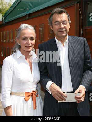 Michel Denisot and his wife arrive in the 'Village', the VIP area of the French Open at Roland Garros arena in Paris, France on June 6, 2007. Photo by ABACAPRESS.COM Stock Photo