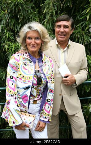 French TV presenter Jean-Pierre Foucault and his wife arrive in the 'Village', the VIP area of the French Open at Roland Garros arena in Paris, France on June 7, 2007. Photo by ABACAPRESS.COM Stock Photo