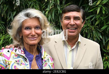 French TV presenter Jean-Pierre Foucault and his wife arrive in the 'Village', the VIP area of the French Open at Roland Garros arena in Paris, France on June 7, 2007. Photo by ABACAPRESS.COM Stock Photo