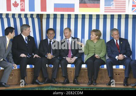 G8 Heads of State pose in a giant beach chair for a family picture in front of the Kurhaus building in Heiligendamm, northeastern Germany, during their first working session at Heiligendamm, Germany on June 7, 2007.(L-R) Japanese Prime Minister Shinzo Abe, Canadian Prime Minister Stephen Harper, French President Nicolas Sarkozy, Russian President Vladimir Putin, German Chancellor Angela Merkel, US President George W. Bush. Photo by Ludovic/pool/ABACAPRESS.COM Stock Photo