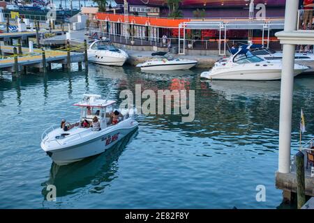 A family powerboat outing at the Bayfront Marketplace located on Biscayne Bay in Miami, Florida. Stock Photo