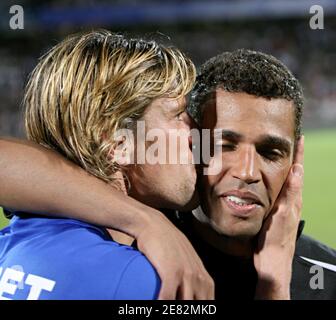 Lyon's goalkeeper Gregory Coupet kisses Sonny Anderson during his testimonial match in the Gerland stadium in Lyon, France on June 11, 2007. Photo by Vincent Dargent/Cameleon/ABACAPRESS.COM Stock Photo