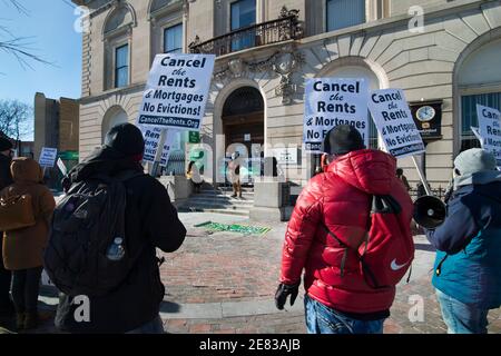 Boston, Massachusetts, USA. 30th Jan 2021:  Cancel the Rents & Mortgages demonstration.  About 50 Boston Residents gathered on a cold winter day during a National Day of Action to call for rents and mortgages be canceled due to the financial insecurity caused by the Coronavirus, COVID-19, pandemic. Credit: Chuck Nacke/Alamy Live News Stock Photo