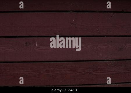 Wooden Planks of old timber house painted in red Stock Photo