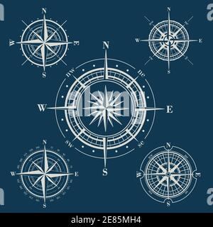 Set of compass roses or wind roses on blue background Stock Vector