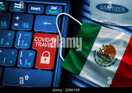 Mexico COVID-19 coronavirus travel restrictions concept showing red key warning on keyboard with Mexican flag face mask and hand sanitizer. New normal Stock Photo
