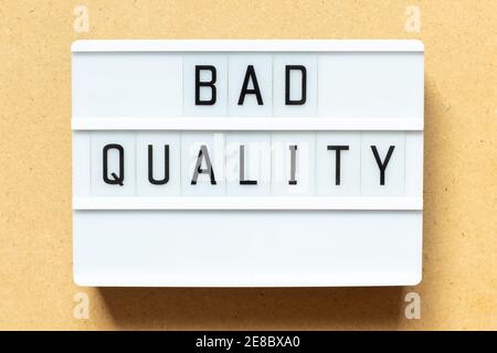 Lightbox with word bad quality on wood background Stock Photo