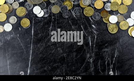 Assorted Malaysian Coins on Dark Marble Background Stock Photo