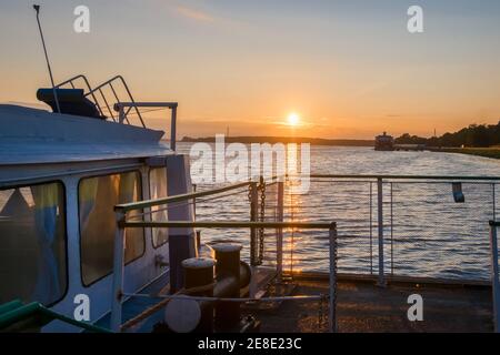 Pleasure ship on a summer evening at sunset on the Volga River Stock Photo