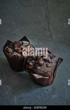 chocolate muffins on a dark background Stock Photo