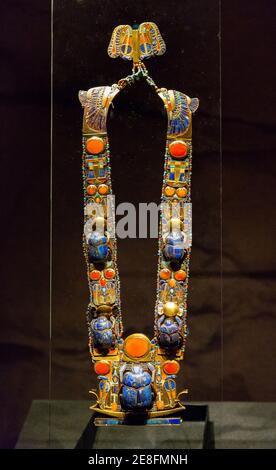 Egypt, Cairo, Tutankhamon jewellery, from his tomb in Luxor : A complex flexible pectoral showing a barque, solar snakes and a scarab. Stock Photo