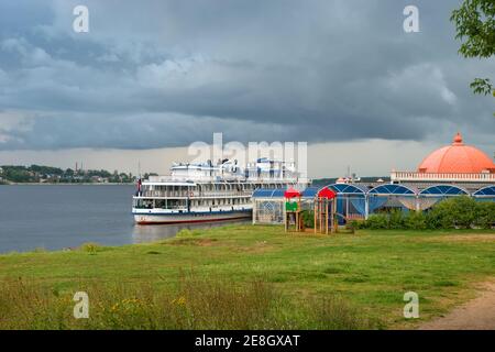 Cruise ship at the pier on the Volga river in the city of Kostroma on a summer evening Stock Photo