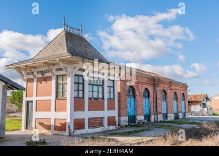 platform of old abandoned train station in sunny day and blue sky with clouds Stock Photo