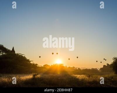 Bagan, Myanmar - Hot-air balloons for sightseeing thousands of pagodas at the first sunrise of the year. Stock Photo