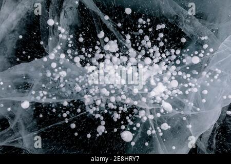 Top view of amazing frozen methane bubbles under water of icy Lake Baikal in winter as abstract background Stock Photo