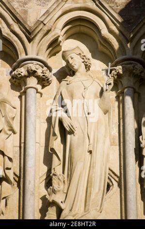 Statue of Saint Margaret of Antioch on the West Front of Salisbury Cathedral, Wiltshire. Sculpted by James Redfern in the 19th Century and on public d Stock Photo