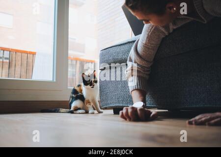Front view of two men sitting casually in a jeans shop while talking to each other Stock Photo