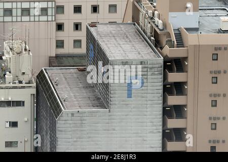 View to high skyscrapers towers and small buildings in big city Stock Photo