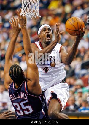 The Philadelphia 76ers' Chris Webber (4) is fouled by Washington's ...