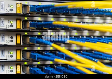 Control panel of optical fiber wires installed in communications room for providing process and network access Stock Photo