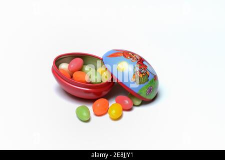 Sugar eggs in tin egg with rabbit figure Stock Photo